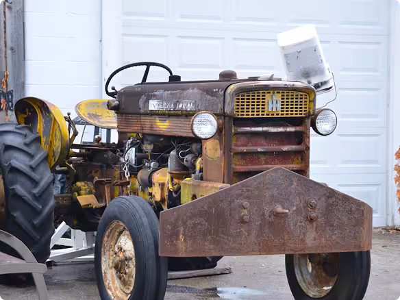 Restored vintage tractor on farmland